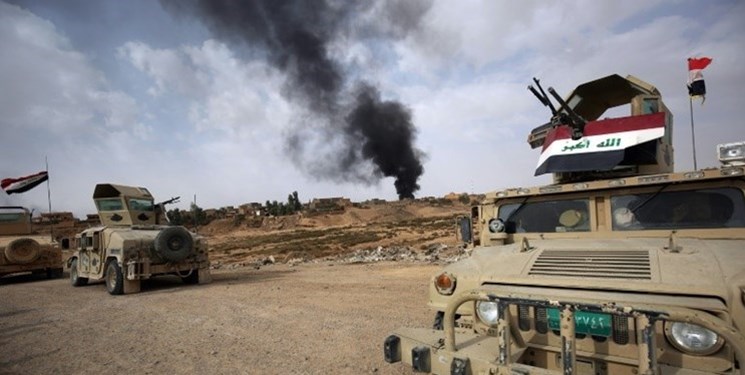 العراق: الجيش والحشد يشتبكان مع “داعش” إثر شنه هجوماً مستغلاً عدوان واشنطن